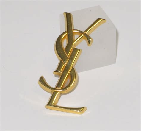 hot to tell if ysl brooch is real|real ysl logo.